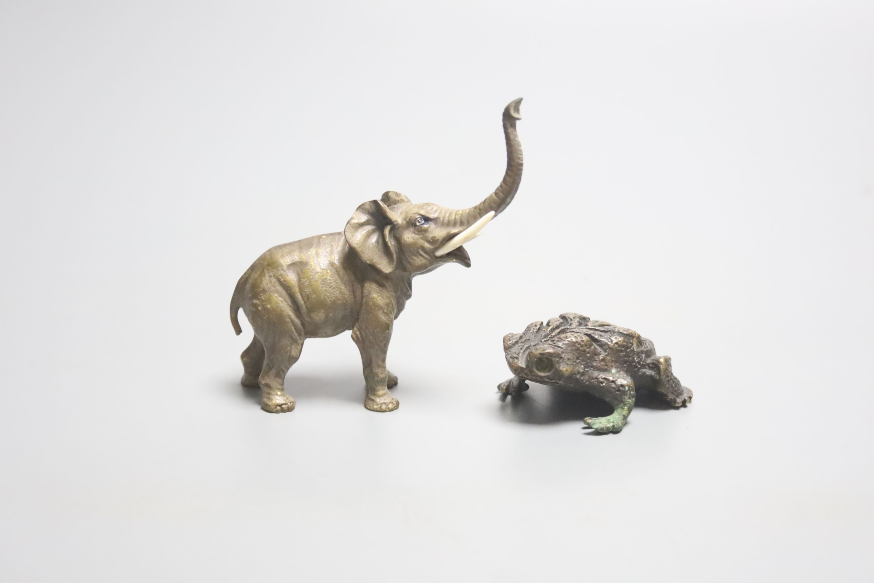 A miniature bronze elephant and a frog